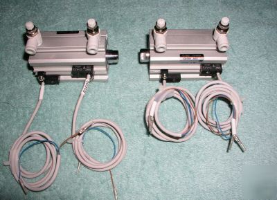 Two smc CDQ2B32-50DC air cylinders with d-A73 sensors