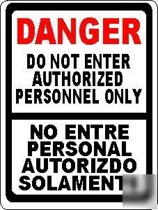 Danger bilngual authorized personnel sign autorizdo no